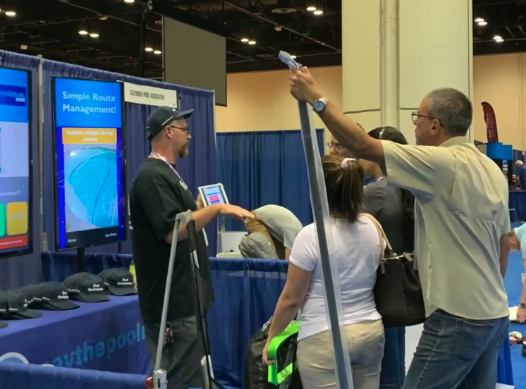 Jeff Posth, Paythepoolman founder, demonstrating route management at a pool industry trade show